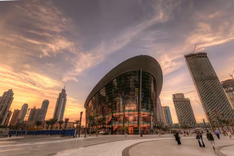 Dubai Opera exterior at sunset with dhow-shaped architecture in Downtown Dubai